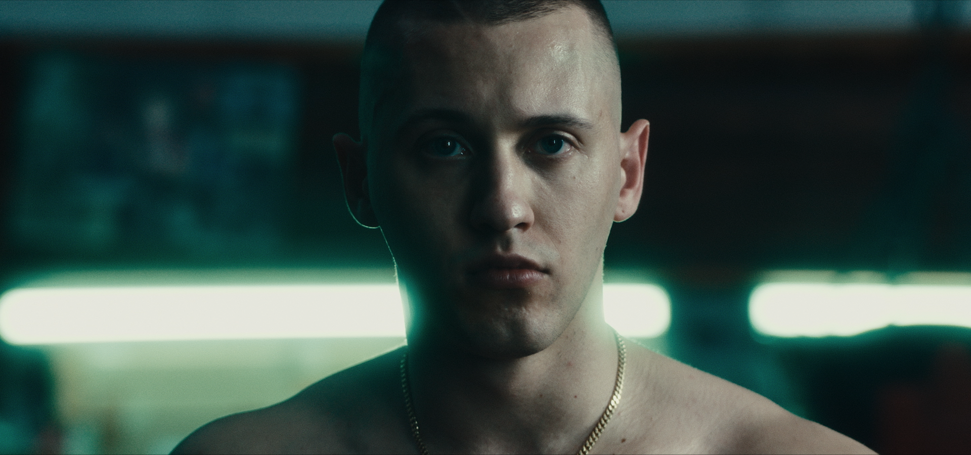 A close-up of Massimo Pericolo in cool gym light