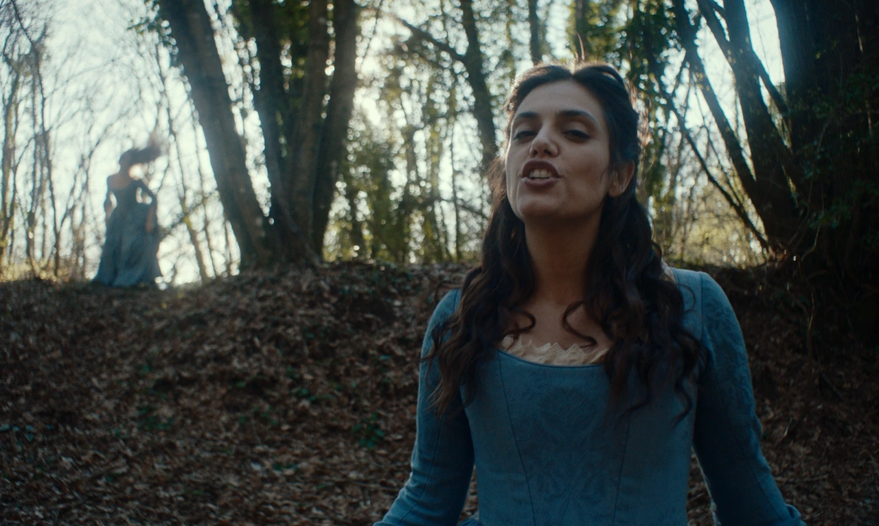 A woman singing in the woods with another figure behind her