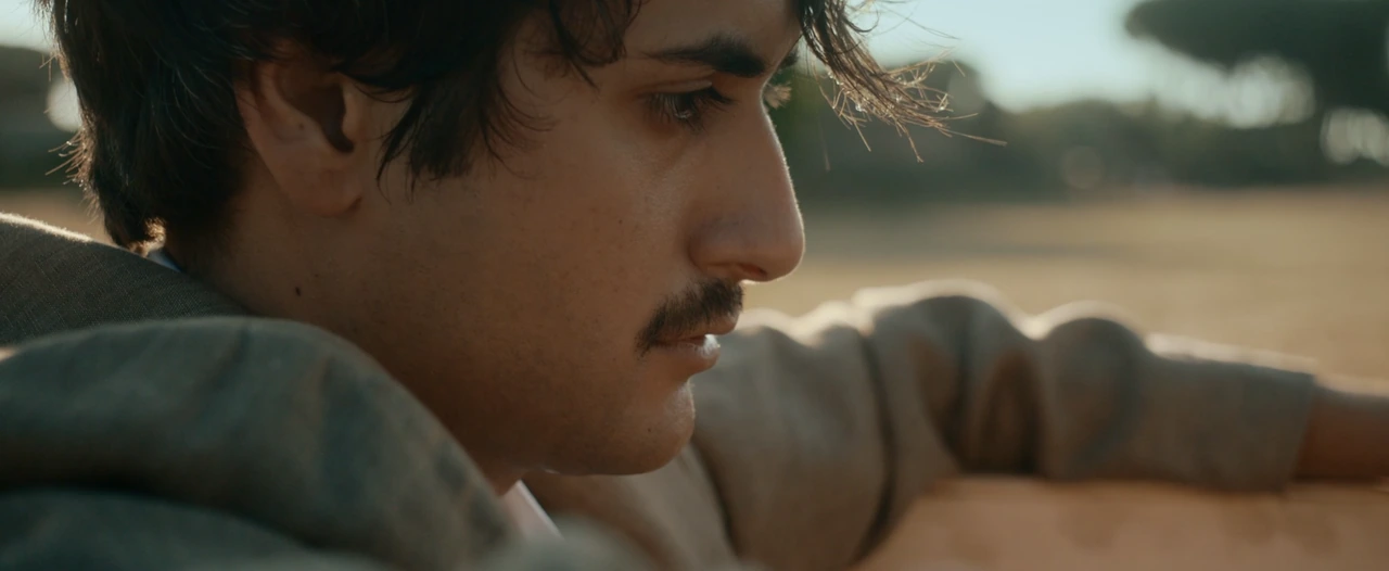 A close-up of a man outdoors in daylight