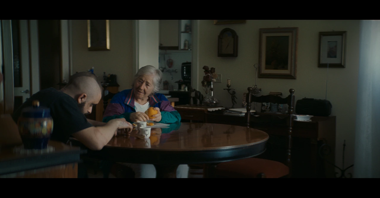 A man and an older woman sitting at a table