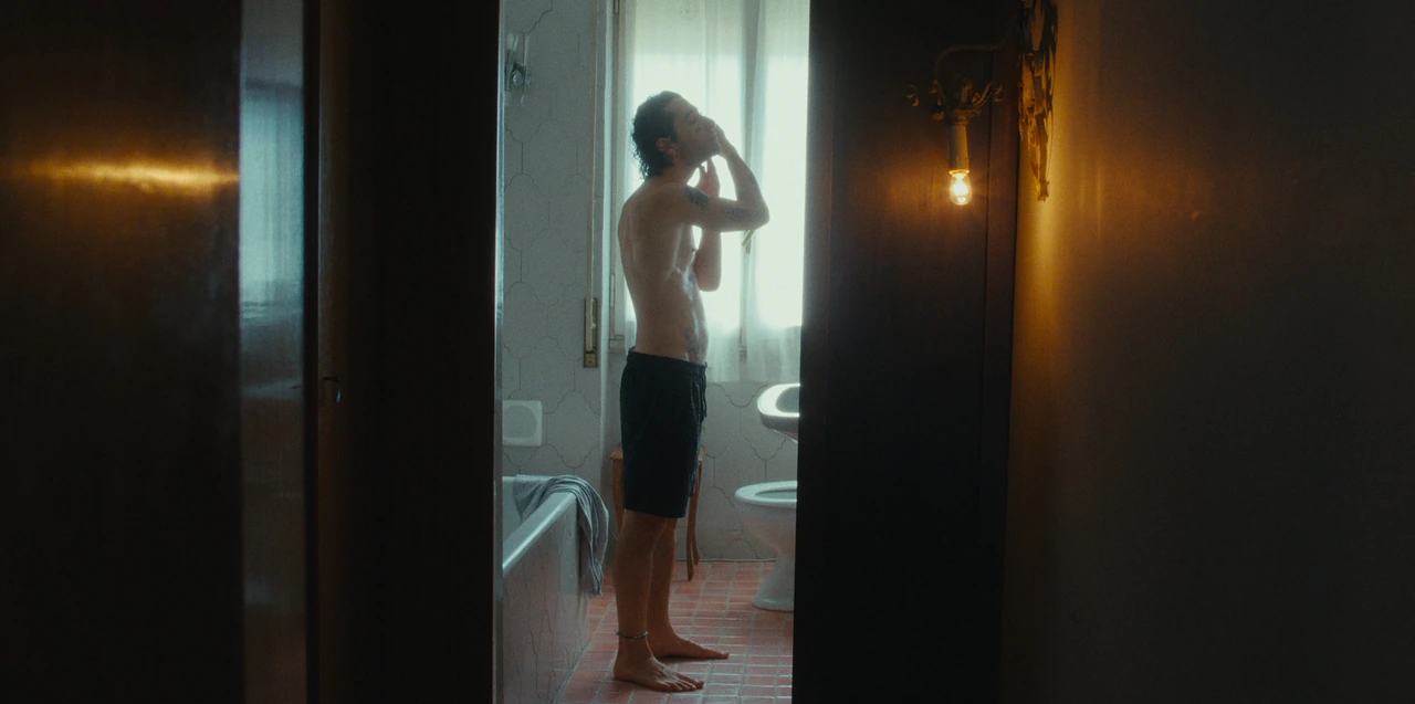 An adult standing in a bathroom doorway