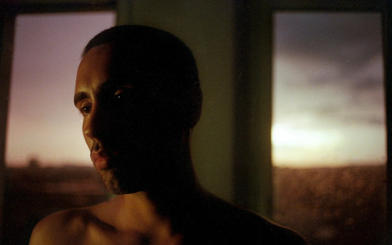 A portrait in warm fading window light